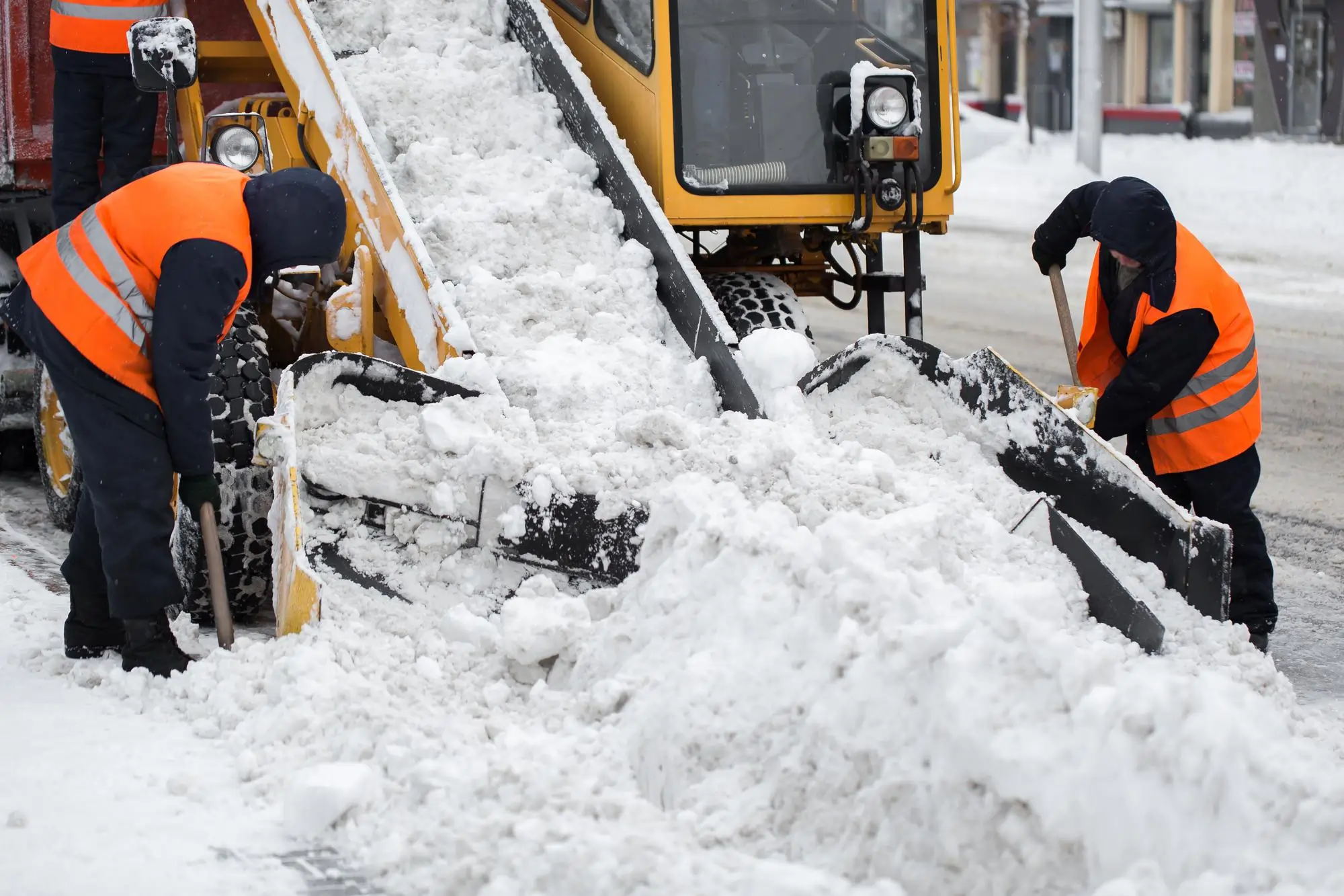 snow clearing by excavator